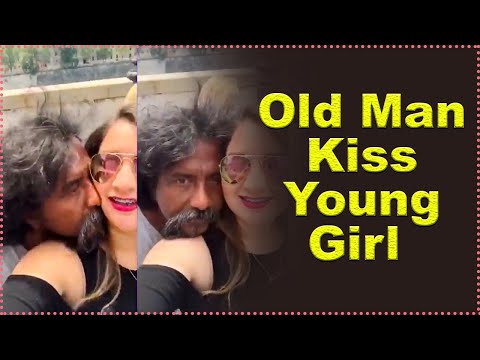 old man kiss young girl in public place