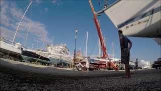 Removing the mast, adding a 3rd halyard, new vhf wire and antenna, and LED anchor light.
