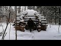 bushcraft. shelter in the forest. meat in a candle