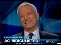 Anderson cooper giggles on live tv