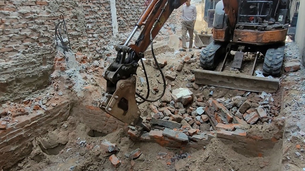 Old Foundations Crumble Under Excavator Force