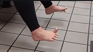 Candid Barefoot Latina Toes In Restaurant