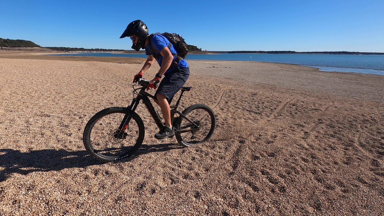 SCOTT Strike full suspension E-MTB riding in deep gravel.