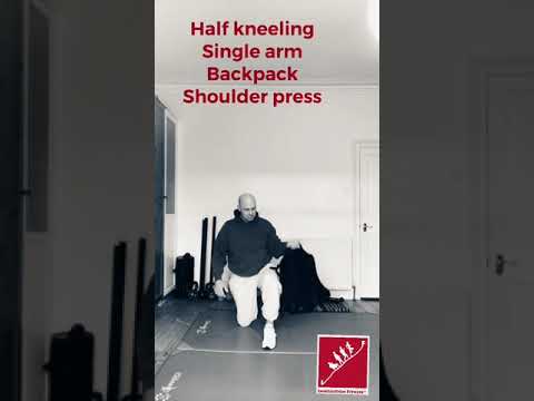 Half kneeling shoulder press with a backpack