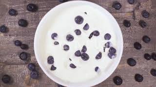 in a Bowl of Yogurt Falling Berries Top View | Stock Footage - Videohive