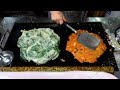 Korean street food - Kimchi Vegetable Pancakes in the Traditional market