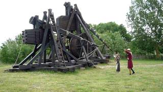 (Big one is in background) Firing of small trebuchet during visit to open-air Medieval Center at Lolland-Falster in Denmark. My 