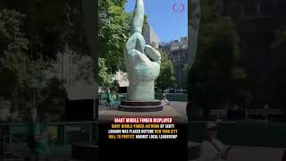 middle-finger sculpture by artist Scott LoBaido has been installed in front of New York City Hall