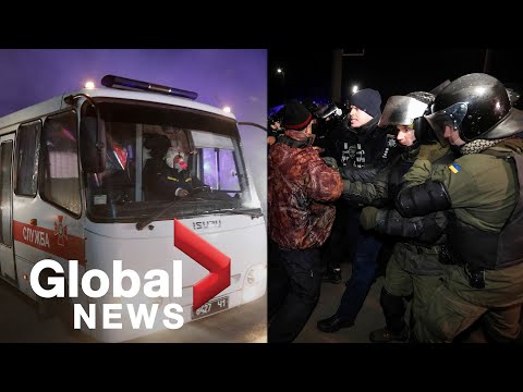 Coronavirus outbreak: Ukrainian police scuffle with protesters as China evacuees arrive