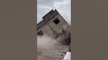 Building Collapses into Raging River