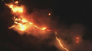 At least 10,000 structures have burned in a series of fires around Los Angeles
