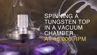 Spinning a Tungsten Top in a Vacuum Chamber