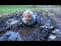 The kids fall and lie down in muddy puddles. CRAZY!