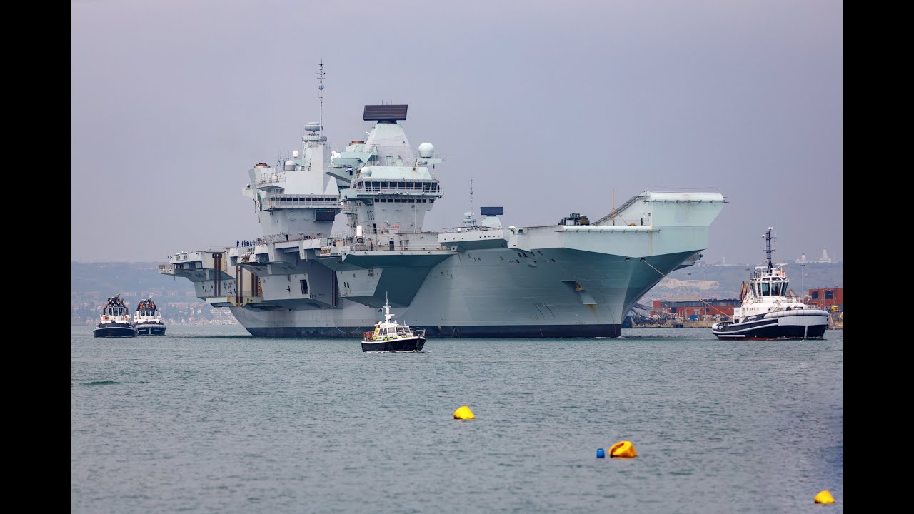 HMS Queen Elizabeth (R08) aircraft carrier leaving Portsmouth