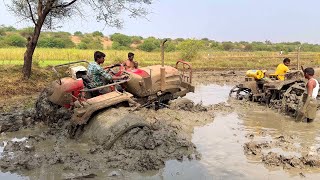 Solis tractor stuck in mud pulling out by John Deere tractor | tractor |