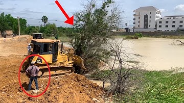 New Project Filling Land Dozer KOMATSU DR51XP Clearing Forest & working pushing into the water.