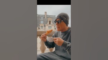 Thumbnail of Van Damme Enjoys Coffee and Croissant on a Paris Balcony!  #VanDamme#ParisVibes#CoffeeMoments