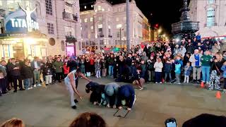 Performance by stuntman at Piccadilly Circus London