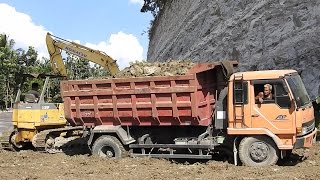 Excavator Dump Truck And Dozer Working Hard