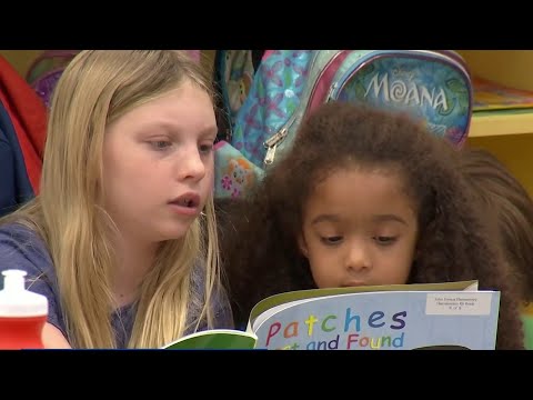 ‘We get to help them read,’ Seminole County elementary school pairs fourth graders and kindergar...