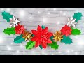 Christmas wall decorations. paper poinsettia false holly.