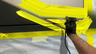 Dion Re painting a custom paint job on a million dollar prevost coach