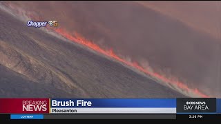 Brush fire burning in remote area of Pleasanton