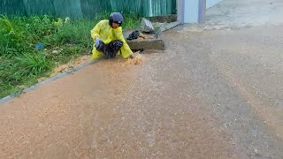 Unclog Culvert Drain Releasing Water That Flooded Street Drain