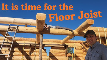 Putting up the Floor Joist on this log home.
