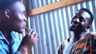 Mbate na mwanae Akimfudisha Kusoma