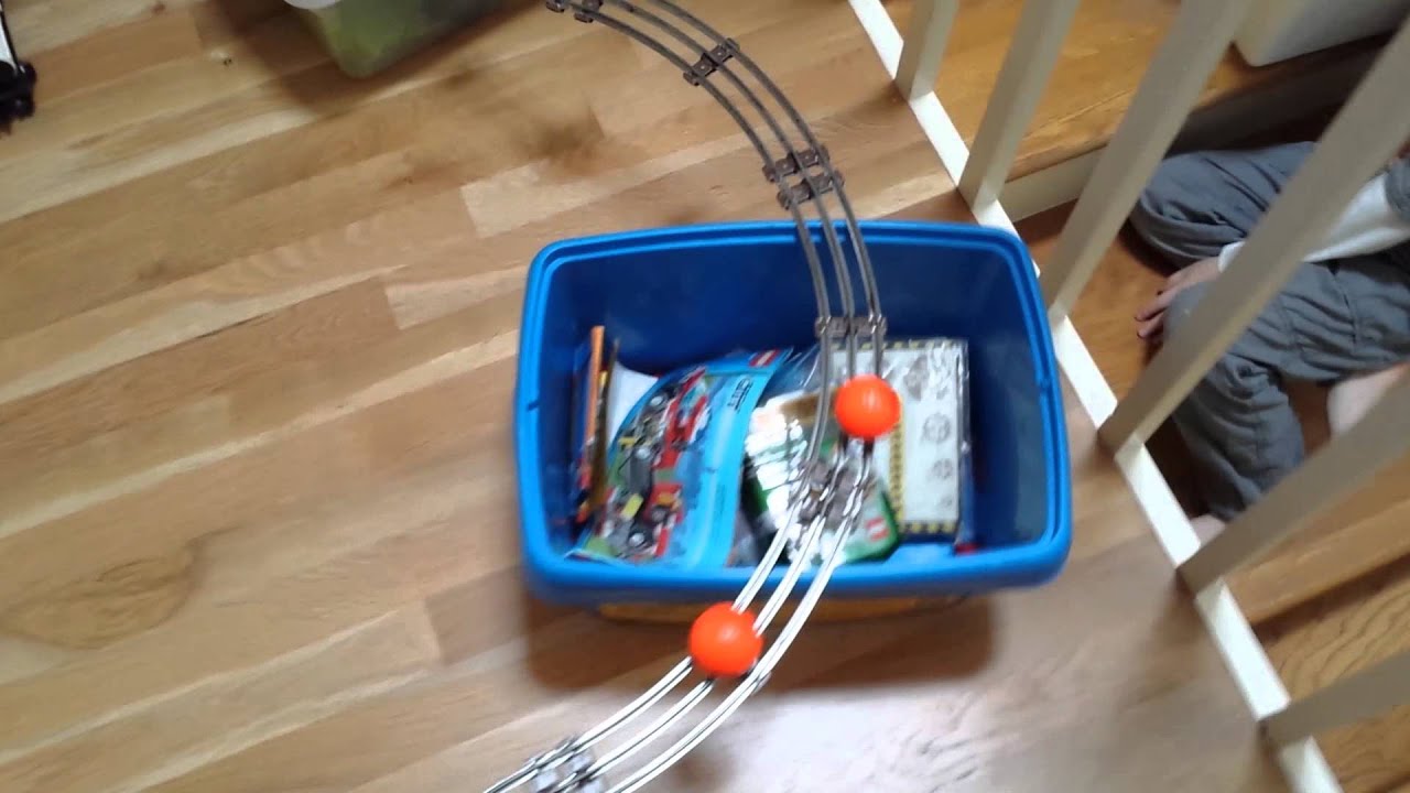 KISS mini golf balls go down railroad tracks. YouTube