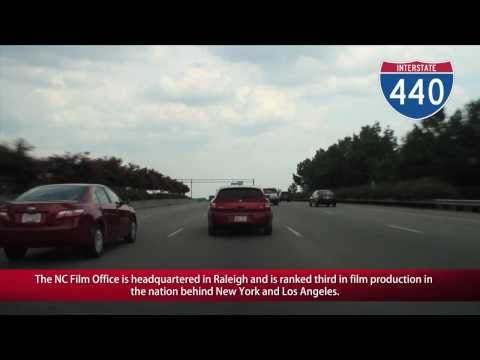 This video begins briefly along US 1 / 64 in Cary, NC at the I-40 interchange and concludes near the new Knightdale Bypass (US 64 / 264) in eastern Raleigh. I-440 is a 16.4 mile beltline around Raleigh's inner core neighborhoods. It is often referred to formally as the "Cliff Benson Beltline" or just simply "440". The stretch from US 1/64 in Cary clockwise to US 1/401 (North Boulevard then; Capital Boulevard now) was finished in the early 1960s, and was signed as US 1/64. By 1970, the Beltline was extended further clockwise, to New Bern Avenue. This road was signed only as US 64 (US 1 breaks away at North/Capitol Boulevard). Starting in the late 1970s, US 70 was also signed along the Beltline between Glenwood Avenue and North (Capitol) Boulevard, and entered downtown Raleigh on North, rather than on Glenwood. This meant that for a couple of miles, west 70 went east along North Boulevard. Prior to 1991, the northern part of the beltline was designated, but unsigned, as Business Interstate 40 while the southern part remained Interstate 40. Later, the I-440 designation was approved and signed along the entire loop.