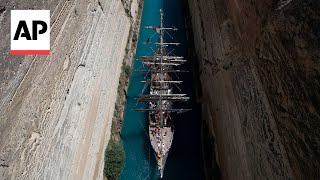 The Olympic flame crosses the Corinth canal en route to Marseille