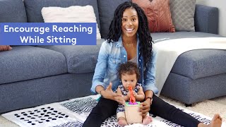 How to Encourage Your Baby to Reach While Sitting | Lovevery