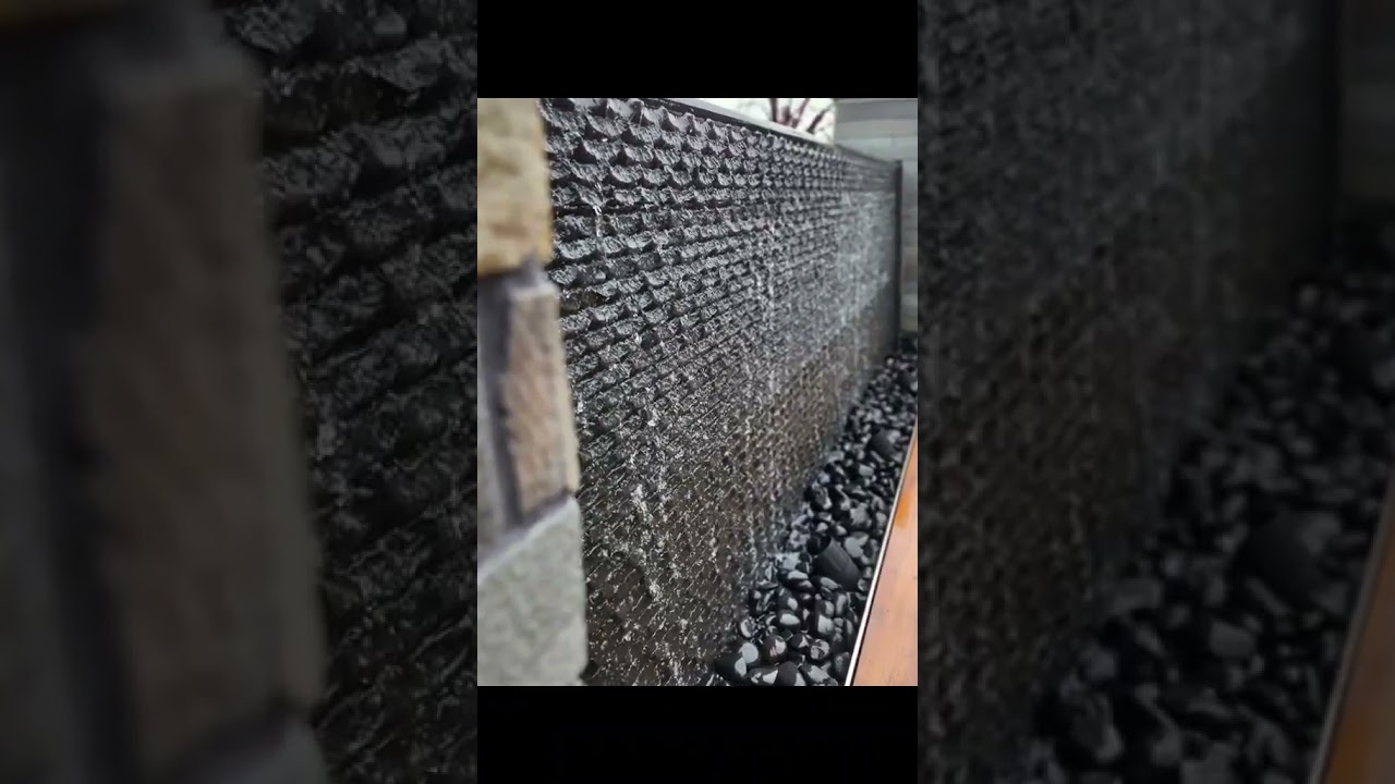 Custom Basalt Water Wall, chiseled by hand  