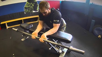 Palms-Up Barbell Wrist Curls Over A Bench