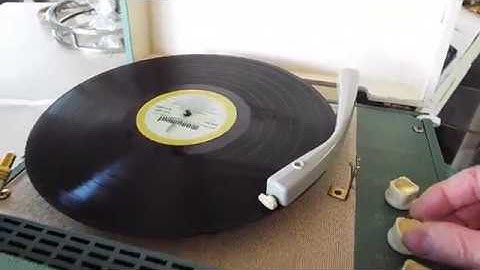 Zenith record player, manual portable 4 speed stereo playing an LP  12" record