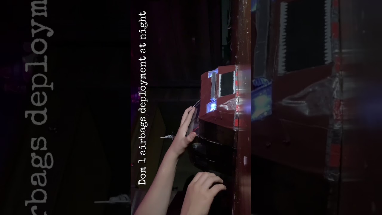 Cardboard Dominator 1 airbag deployment at at night  