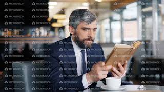 Smart Entrepreneur Reading Book Sitting In Cafe Alone Enjoying Interesting Story