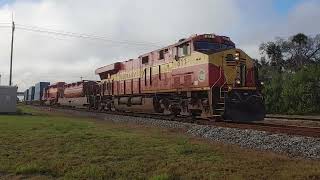 Northbound FEC 811 passing NSB yard with an SD40 3/7/24