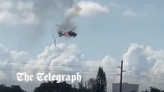 video: Watch: Helicopter on fire crashes into building in Florida