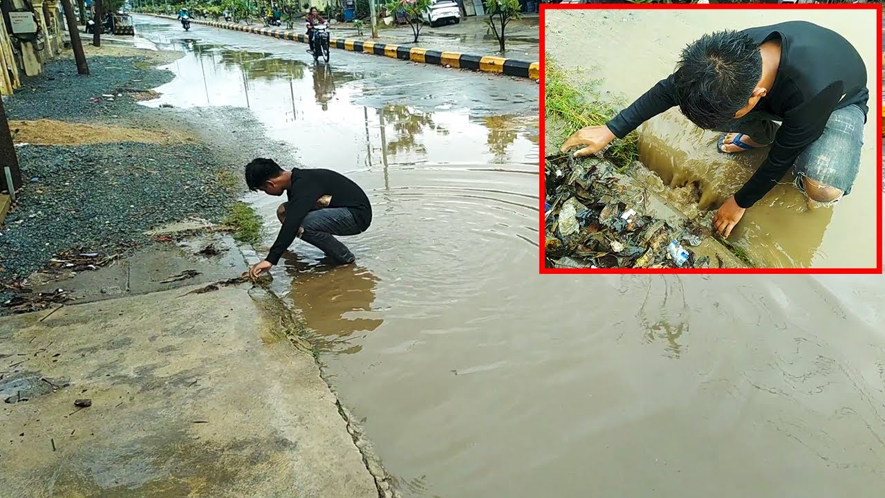 Unclogging Culvert Drain On Street Road After Heavy Rain - YouTube