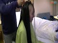 黒髪ロングヘアー女性剃髪