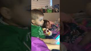 Siblings play games together on iPad while laying in hospital bed. screenshot 5