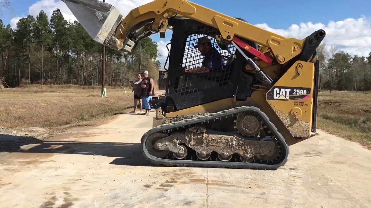 Cat 259D skid steer spreading gravel YouTube