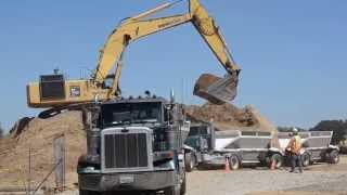 Excavator video: loading trucks on busy construction site (Kids video)