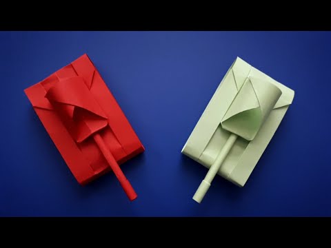 Skilled hands. Handmade from colored paper. How to make a tank out of paper.