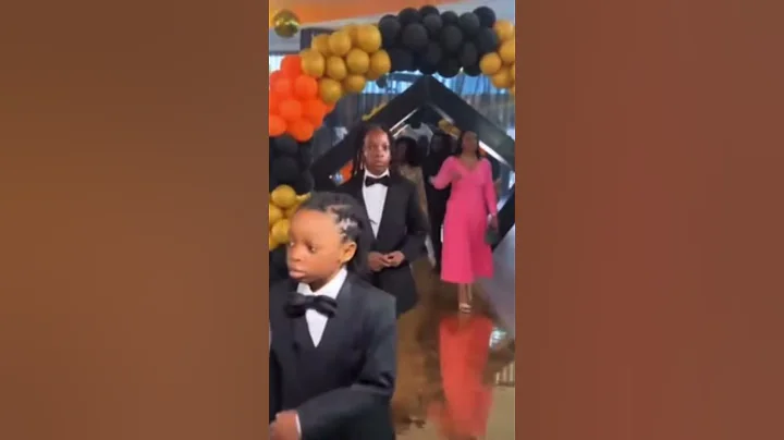 Olamide and his wife celebrating their child Batife 10th birthday