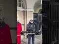 Armed police officer shuts down tourists heckling King
