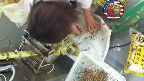 Manual feeding bucket chain feeding filling bag packaging machine for herd different materials